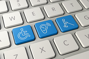 keyboard with buttons that show accessibility icons on some of the keys: wheelchair, ear, cane